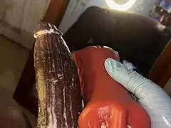 Stocking-clad person deep throats a toy intensely.