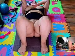 Nude milf spreads her hairy pussy and huge tits during yoga workout