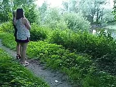 two girls halt on the street, lifting skirts for golden rain in public milf lady adventure