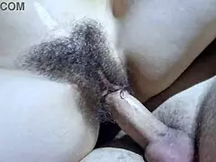 Watch as cum lands on this hairy pussy in the missionary position