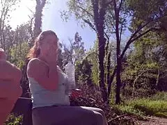 In the park, an exhibitionist seduces a milf to fuck, suck, and get sperm on her face