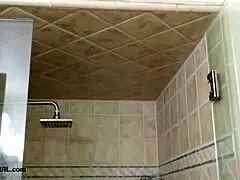 Sophisticated brunette model takes intense shower