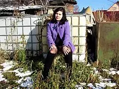 Does this cute milf smoke while showing her naked pussy with dildo and tits outdoors in public?