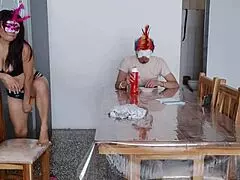 A maid fulfills a request in front of a man at home with charming natural tits