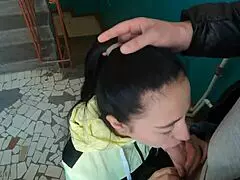 Risky blowjob on public staircase leads to swallowing cum mouthful