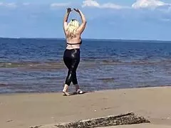 big leather ass strolls along the sandy beach in nature