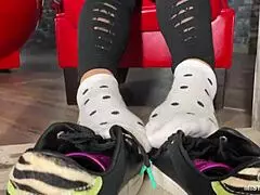 Goddess teases wrinkled feet in socks and barefoot under desk