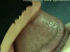 Mature housewife jerks her husband off before delivering a sloppy blowjob in their cozy bedroom.