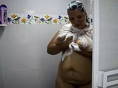 The cute Colombian BBW with huge natural tits gets bent over in the shower, her tight pussy squirting