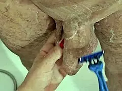 shaving his dick and balls right now