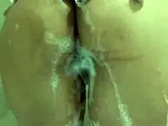 you know, this milf is naked in the bathtub touching her wet pussy between the foam