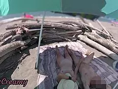 two exhibitionist wives give amateur milf handjob to big cock on nude beach in front of voyeur with cumshot