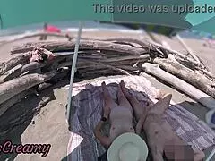 two exhibitionist wives give amateur milf handjob to big cock on nude beach in front of voyeur with cumshot