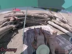 two exhibitionist wives give amateur milf handjob to big cock on nude beach in front of voyeur with cumshot