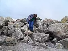 Fat MILF Pisses Outdoors and Smokes. She Shows Her Hairy Pussy Without Panties Under Short Skirt in Public Fetish by the River Bank.