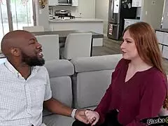 redhead girlfriend teasingly licks her black boyfriend's ass in intimate play