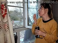 The stepsister lights up a cigarette in a quiet moment