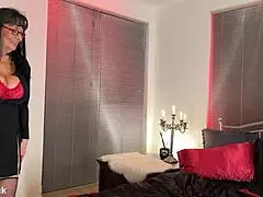 Candlelight glows as brunette milf masturbates to oiled orgasm.