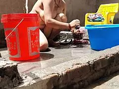 village indian bhabhi bathes outdoors flashing huge tits and shaved pussy for hungry eyes