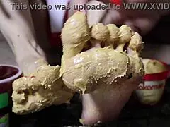 Blonde Bodybuilder Spreads Peanut Butter on Feet for Steamy Footjob Fantasy