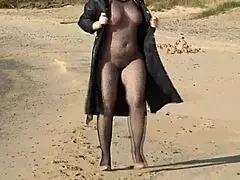 blonde mature wife slips into fishnet bodystocking at party teasing her big ass pussy and nylon legs before stripping naked