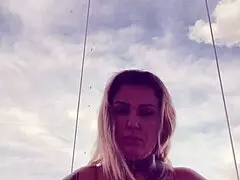 tattooed babe's hard nipples poke through see-through gym top!