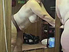 MILF STRIPS DOWN SHOWING OFF HER HUGE ASS AND MASSIVE TITS FOR YOU!!