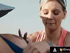 Busty Kenzie Taylor tricks sunbathing Desiree Dulce into outdoor sex