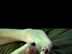 She nervously oils up feet for her very first slippery footjob experience ever