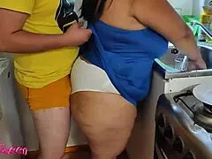 stepmom nympho spreads legs in kitchen for stepson's cock.