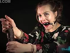 Bound brunette housewife gags on dildo while handcuffed for dirty handjob roleplay