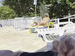 out by the public pool i was stroking my big cock when this busty milf with natural tits spotted me and helped jerk me off till i shot cum everywhere close up