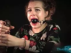 Bound brunette housewife gags on dildo while handcuffed for dirty handjob roleplay