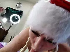 watch this mature santa slut tease then deepthroat cock up close