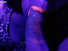 Sexy Misses E sucks cock in UV light