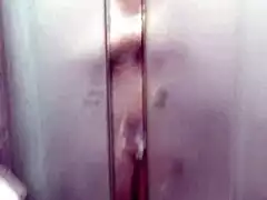 Mature Frina's Big Natural Tits and Wet Pussy Shine in Doorway Shower as Roommate Films Close