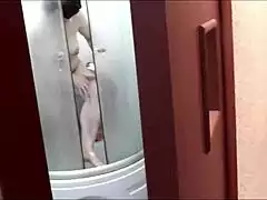 Mature Frina's Big Natural Tits and Wet Pussy Shine in Doorway Shower as Roommate Films Close