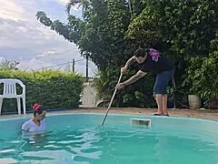 Wife takes husband's friends in kitchen while he cleans pool outside