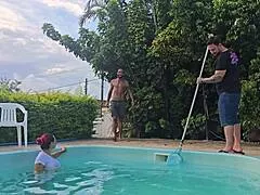 Wife takes husband's friends in kitchen while he cleans pool outside