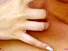 fair-haired model shows off her sexy petite body on sofa