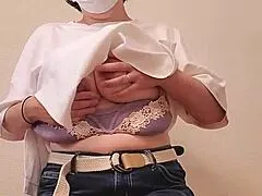 A married woman shakes her hips rhythmically with a toy in this complete video feature