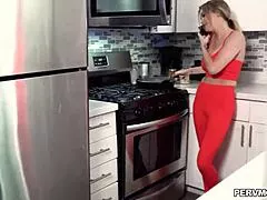 linzee ryder chats closely with stepson in the kitchen