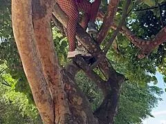 carnival chick climbs tree in the crowd gets pussy fucked and swallows stranger's cum right there