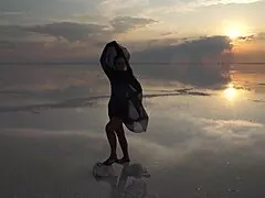 a mature woman performs erotic naked dance on salt lake elton's crust