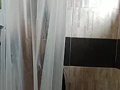 latina milf caught fingering her wet pussy in shower by sneaky voyeur