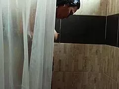 latina milf caught fingering her wet pussy in shower by sneaky voyeur