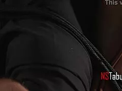 Dominatrix straps on leather shoes to roughly ride submissive lover.