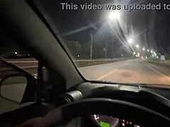 young blonde drops to suck this black cock hard while cruising city streets