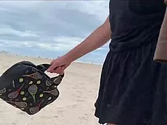a milf strokes stranger's big cock close up on public beach for hot bet