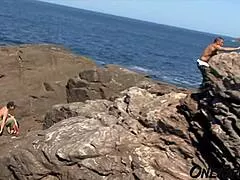 Tanned brunette takes rough anal on rocks